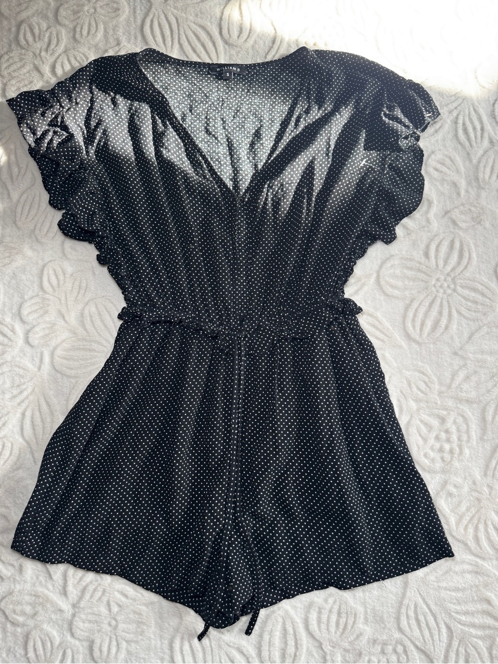 Polka Dot Black Romper with Ruffle Sleeves